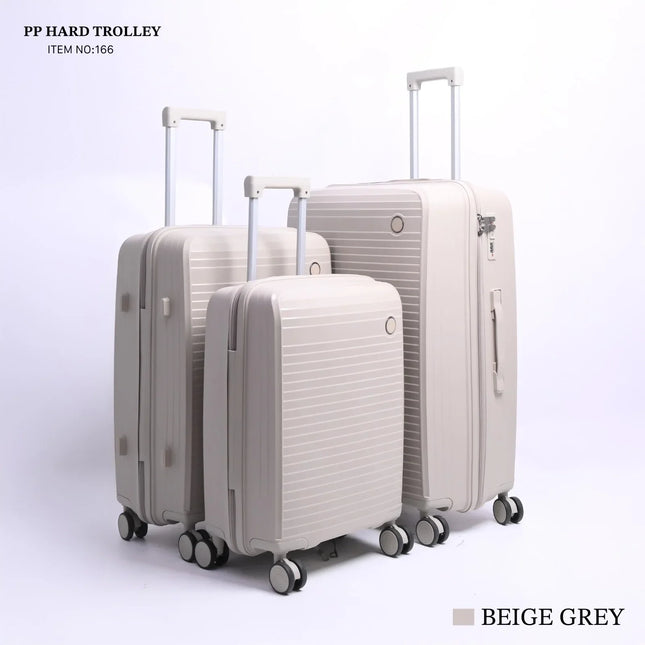 Set of three beige grey hard shell rolling suitcases with telescopic handles