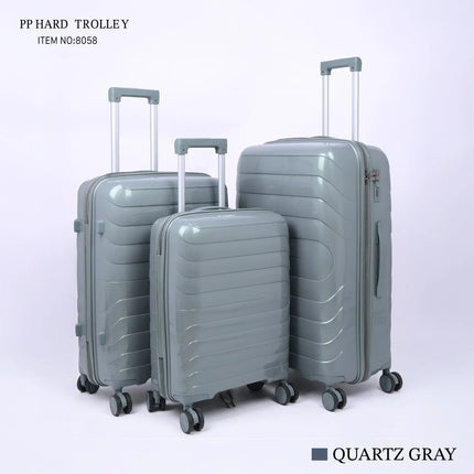 Set of three quartz gray hard shell trolley suitcases with spinner wheels and telescopic handles