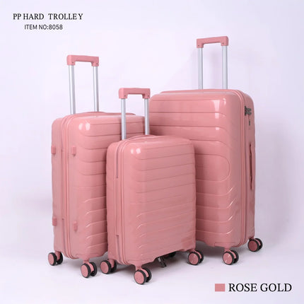 Set of three rose gold hard-shell suitcases with wheels and telescopic handles