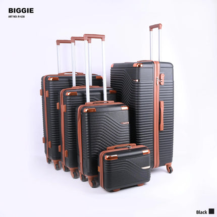 Set of five black hard shell suitcases with brown trim and telescopic handles on white background