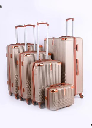 Set of five champagne-colored hard-shell suitcases with wheels and telescopic handles