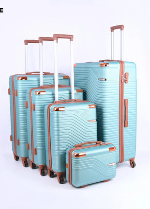 Set of five light green hard shell suitcases with wheels and brown handles, upright on white background.