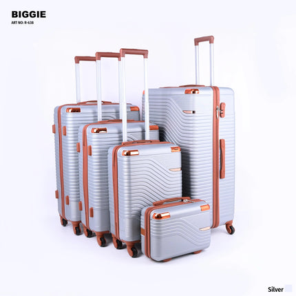 Set of five silver hard-shell suitcases with brown handles and wheels, upright on white background.
